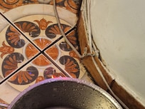 an exposed wire getting wet from the leaking ceiling