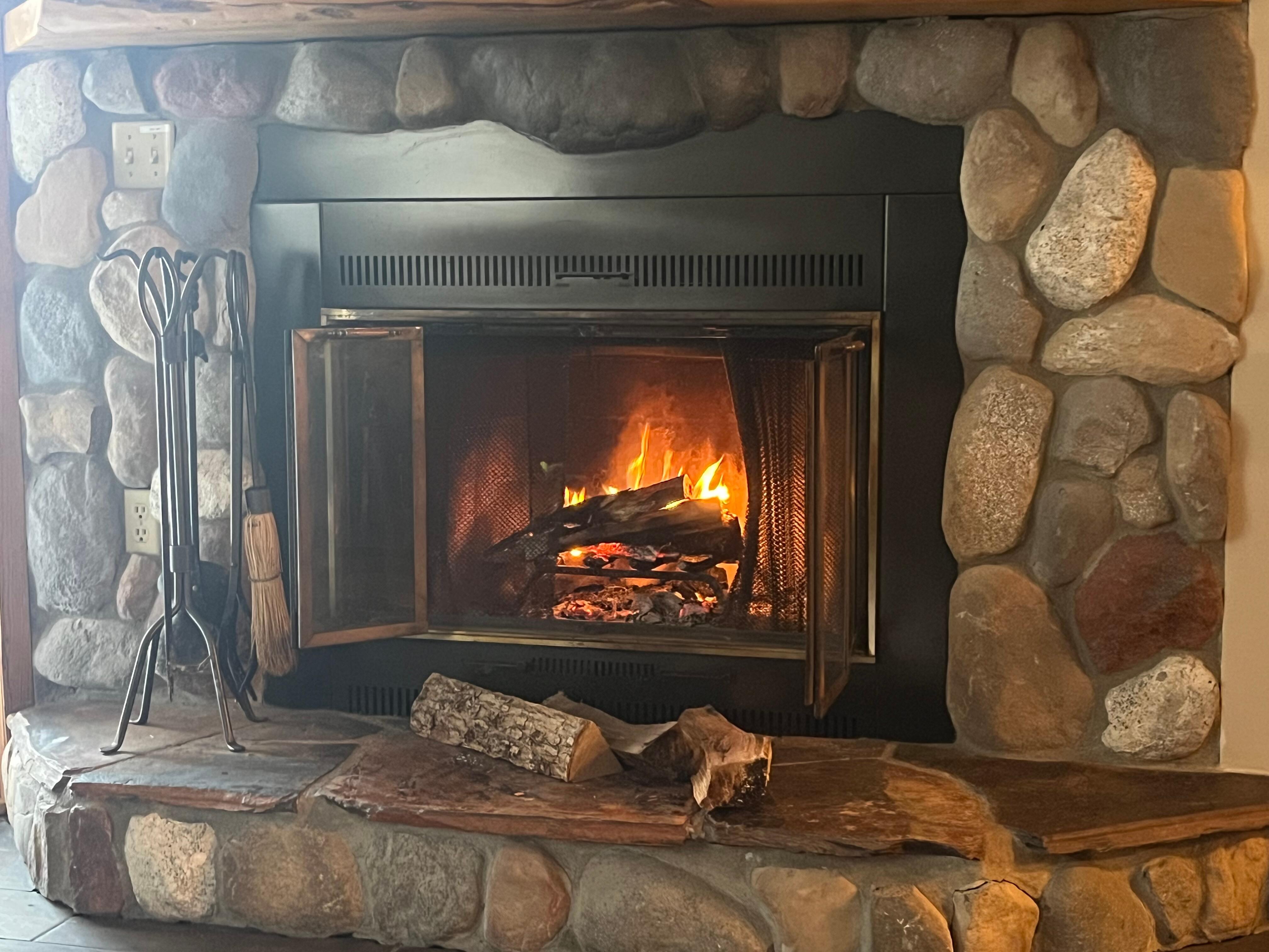 Warmed up by the fire after a long day of skiing.