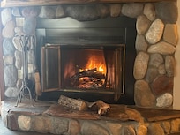 Warmed up by the fire after a long day of skiing.