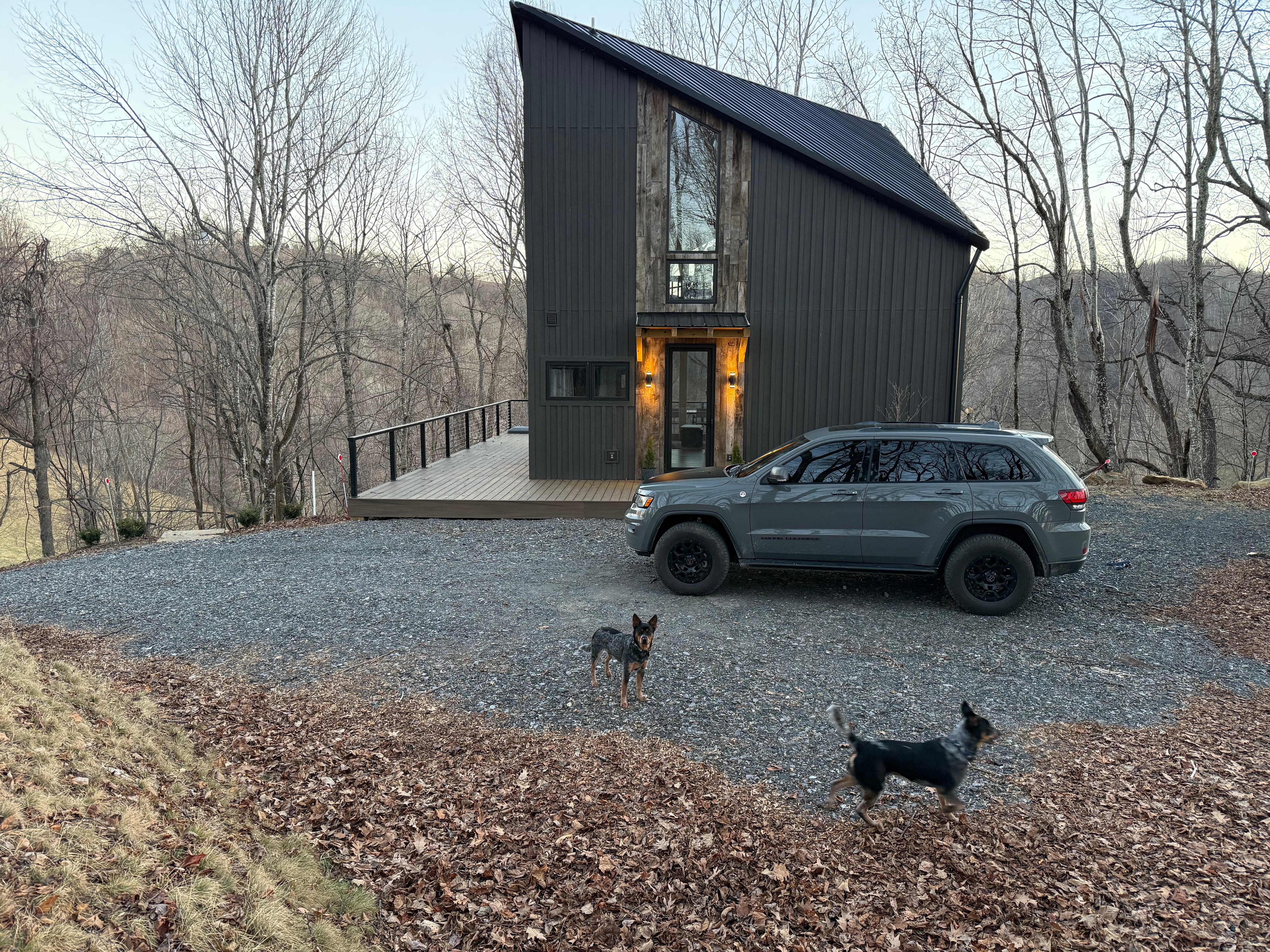 The top driveway and front door area. More parking down below. 