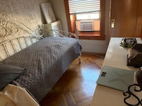 Second bedroom. Distance from bed to dresser where pull out cot is to go is only 29" wide so a 38" twin would not fit.