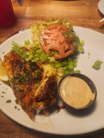 Blackened Mahi Mahi sandwich at The Half Shell Restaurant. Fresh oysters. And Fresh Catch Great Place