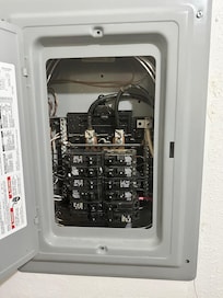 Siemens electrical cover on a Square D circus breaker box