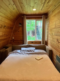 Upstairs bedroom, so cozy and comfortable. Perfect for one person.