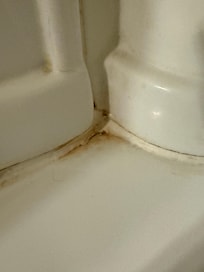 Stained tub caulking