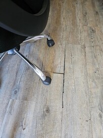 Faux hardwood floor under the desk area.
The stay was to attend a funeral - NOT for leisure.