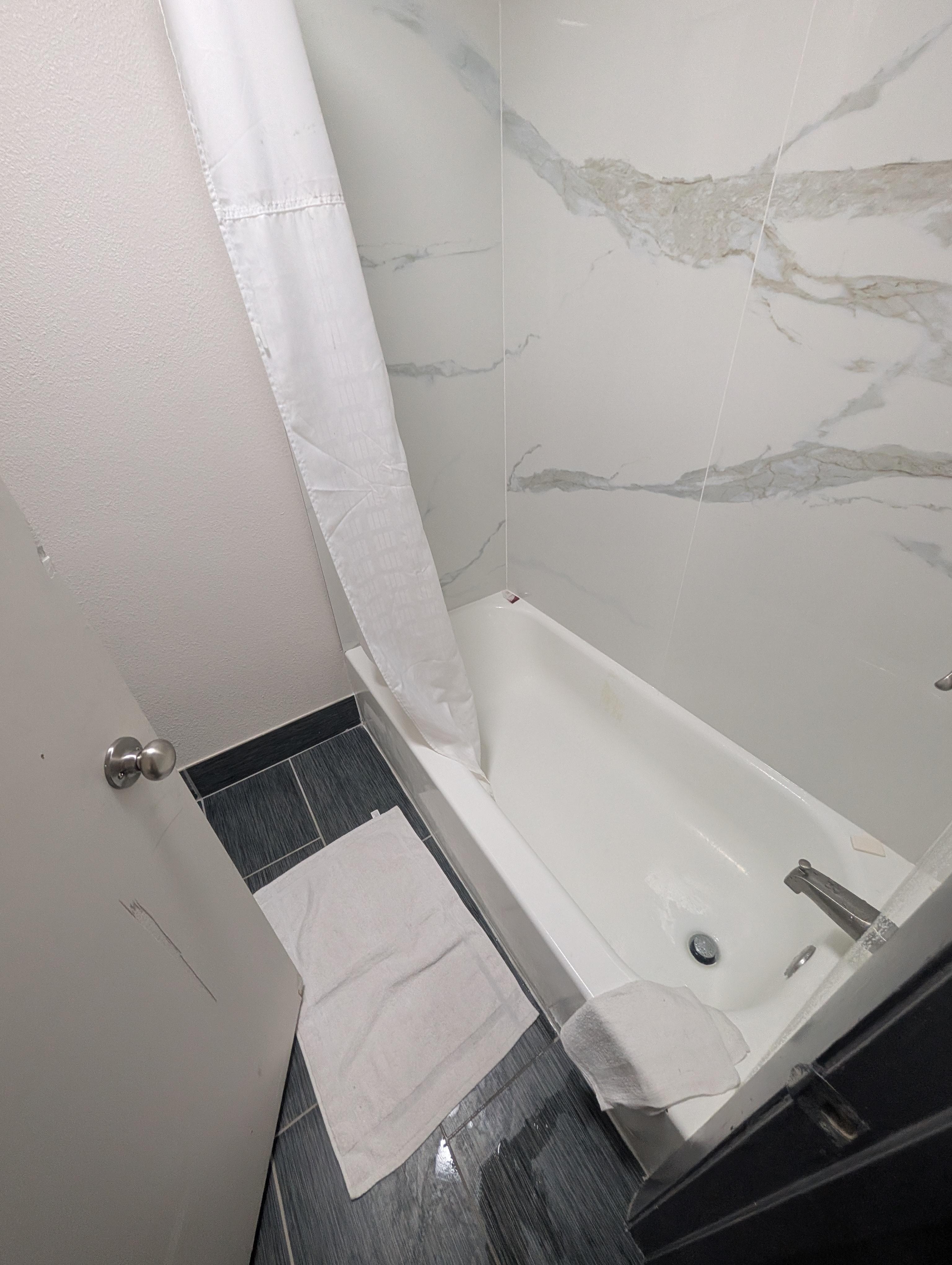 Bathroom with stained floor mat. 