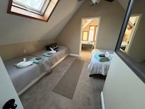 Upstairs walk through bedroom. King Bedroom through a queen, 2 twins bedroom.