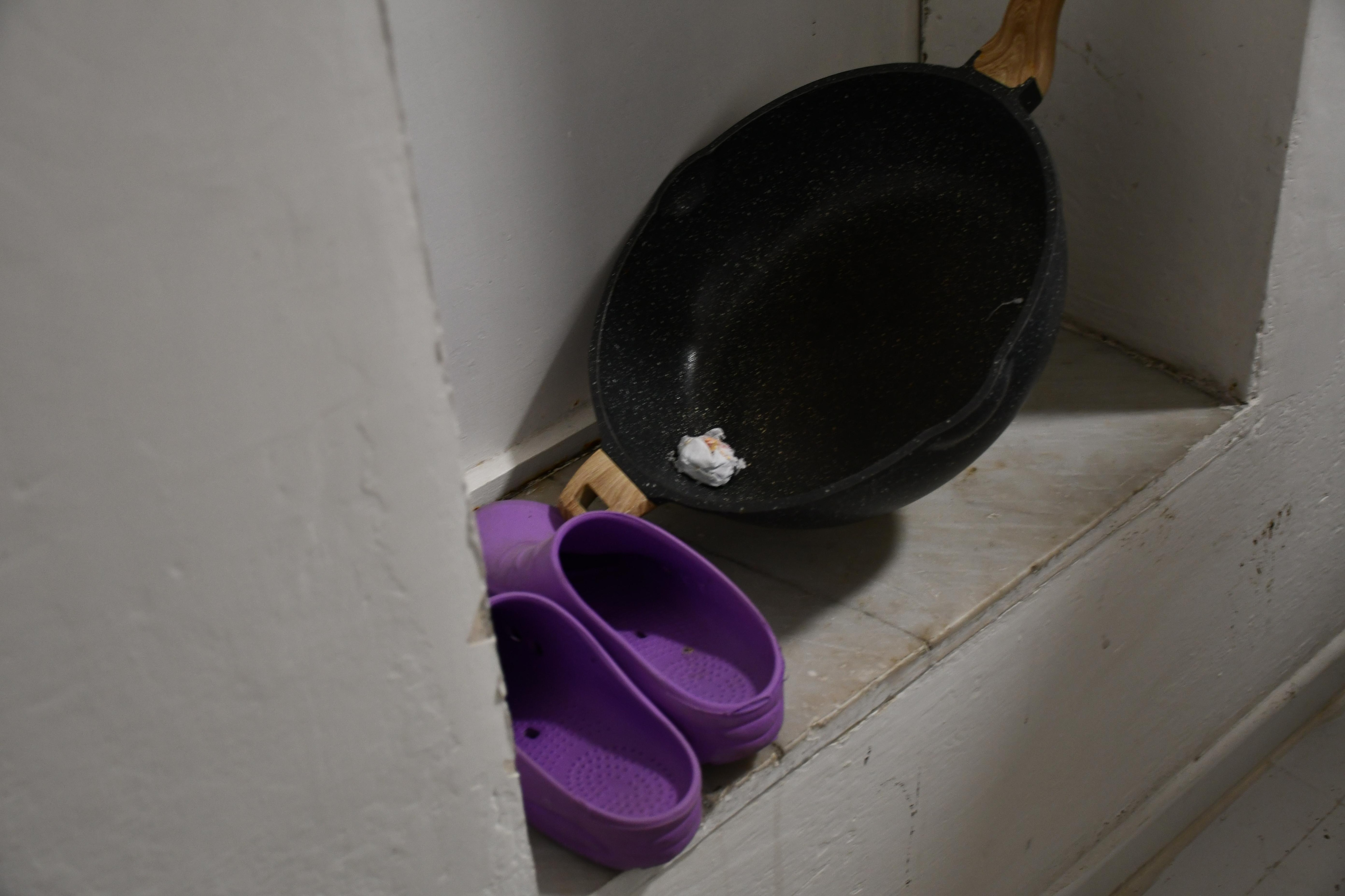 dirty cookware stored in the entryway