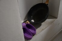 dirty cookware stored in the entryway