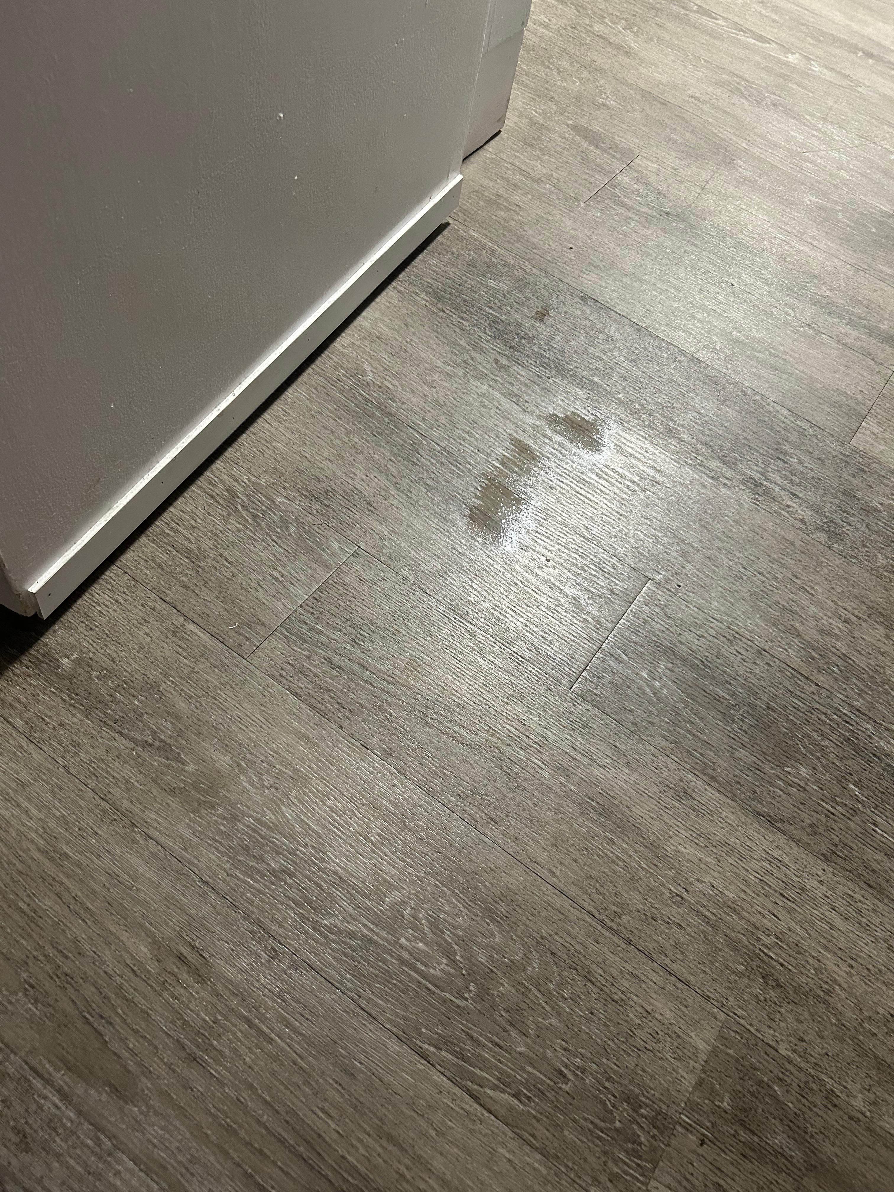Wet foot prints in bathroom. 