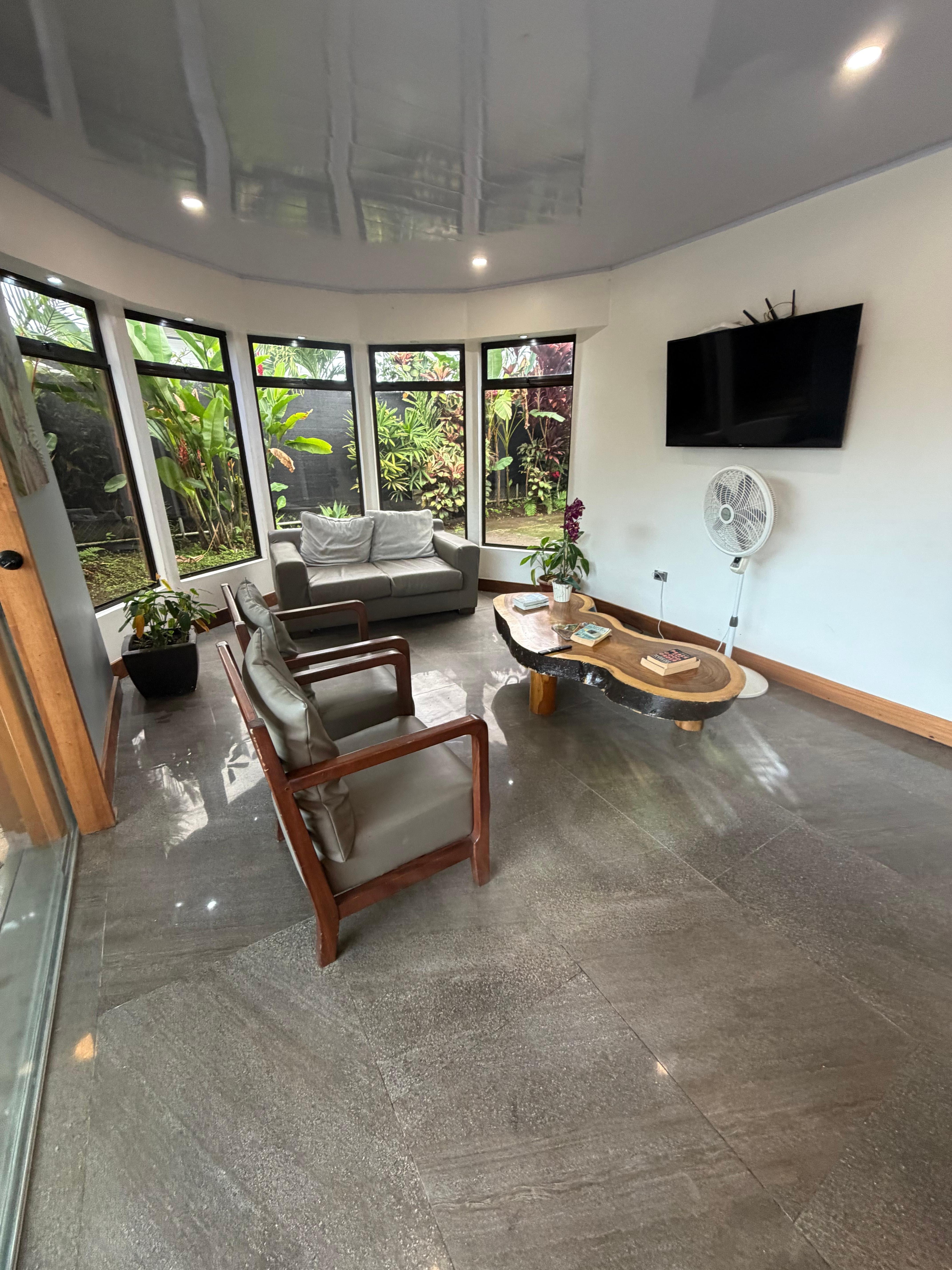 Cozy living room that opens up to the pool