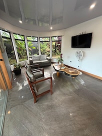 Cozy living room that opens up to the pool