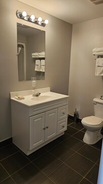 Clean bathroom has a bathtub