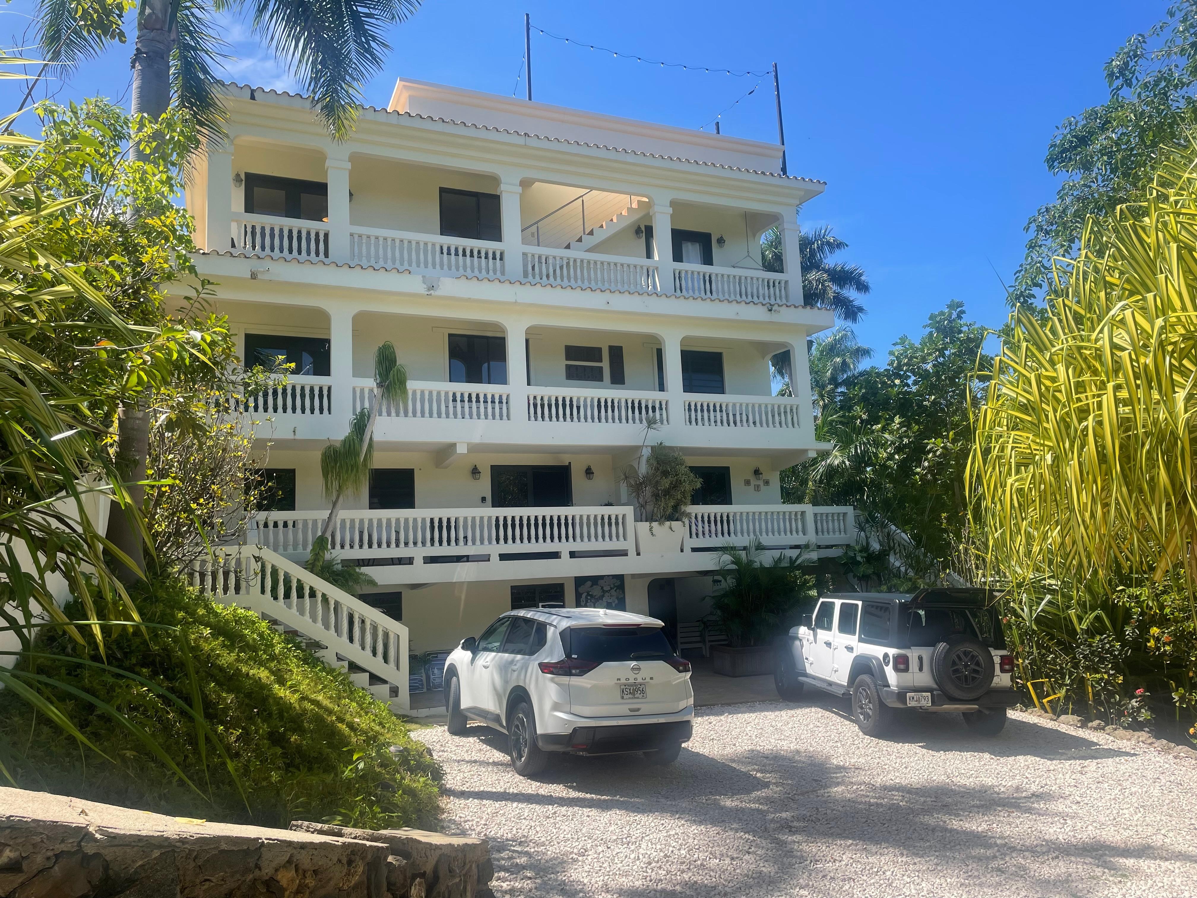 Side of the house, the second parking area, access to the first and second floors.  
