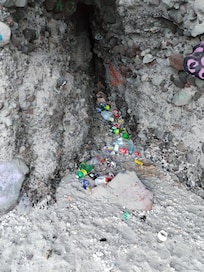 Trash in surrounded areas on the beach
