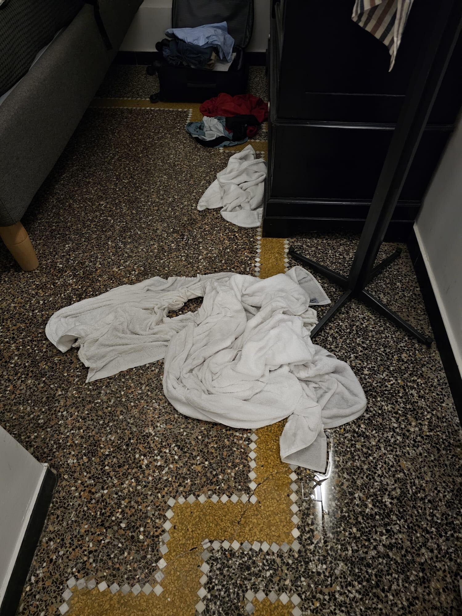 Flooded floor in the bedroom following a quick shower 