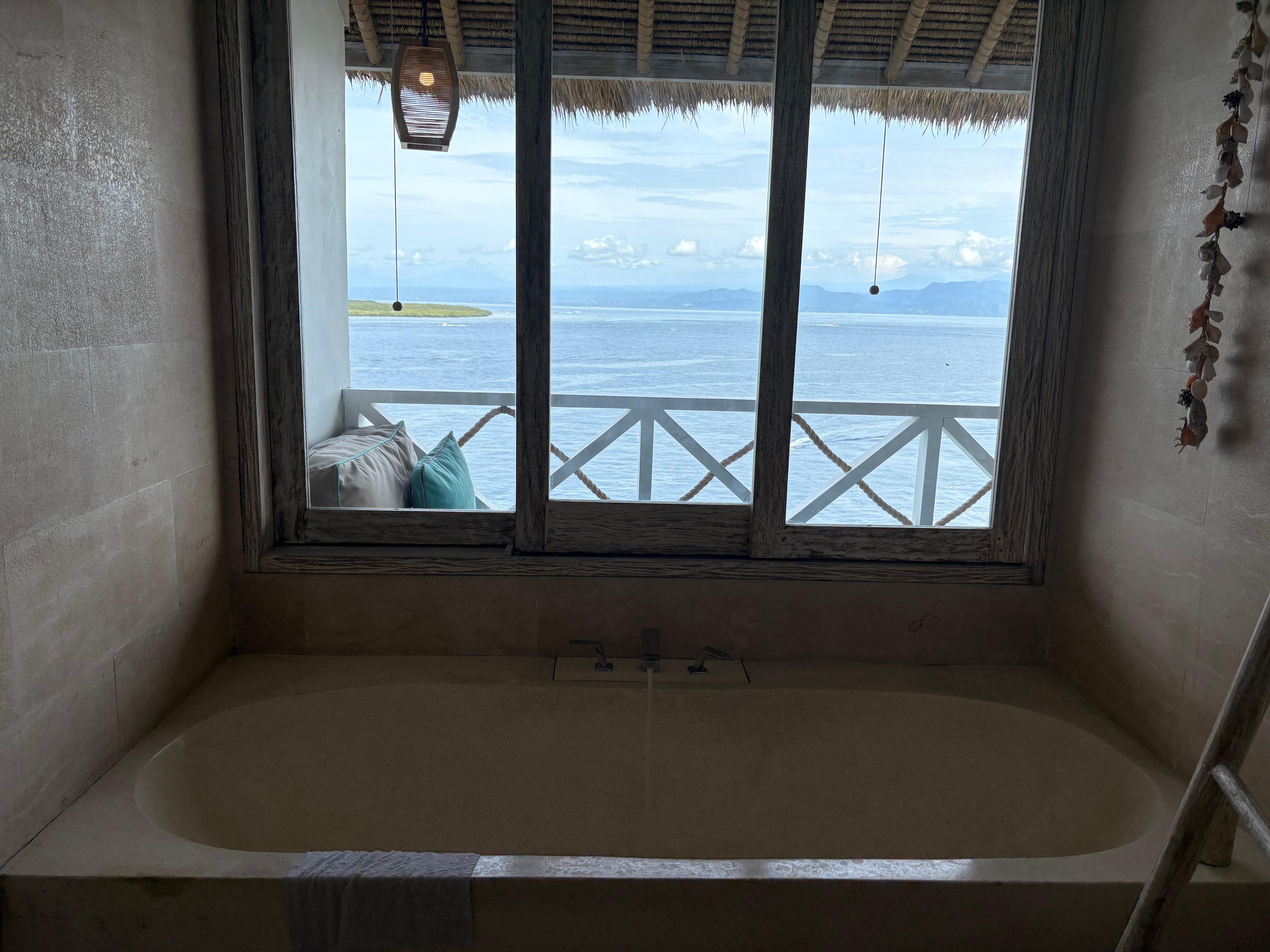 Bathroom with ocean view as a background