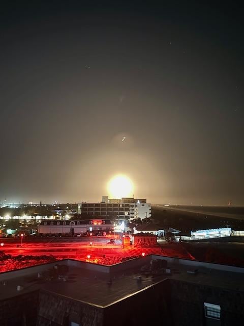 The view of a SpaceX rocket launch from the rooftop.