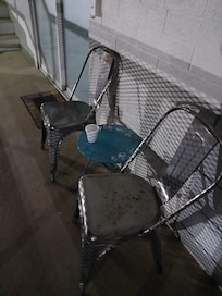 Each room has a few tables and chairs outside of them