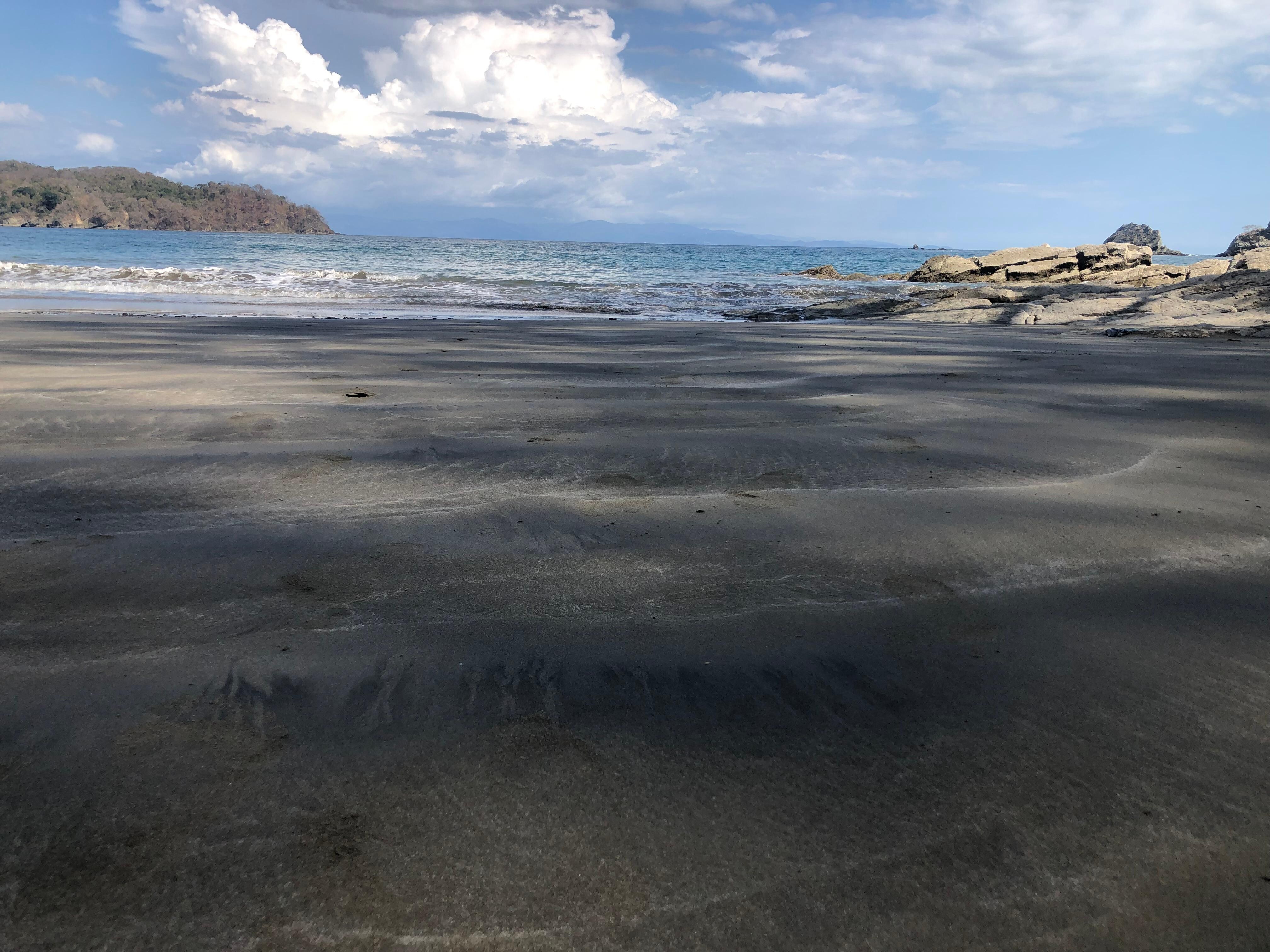 Beach with only one other couple on it.