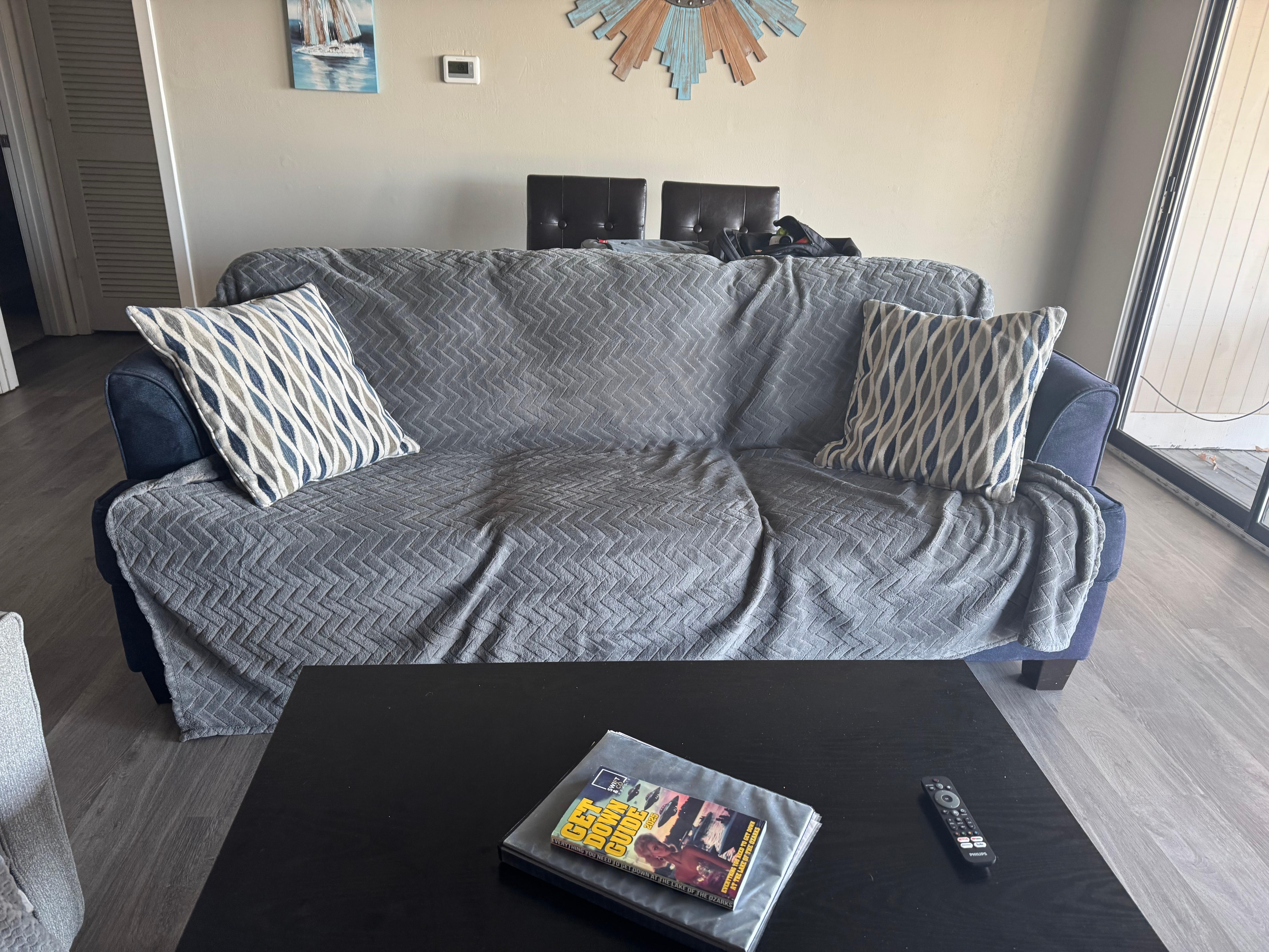 Blanket over an old hide a bed couch