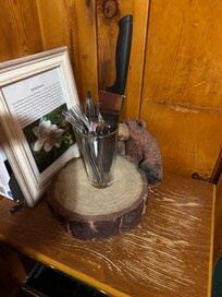 Silverware stuffed in a glass.