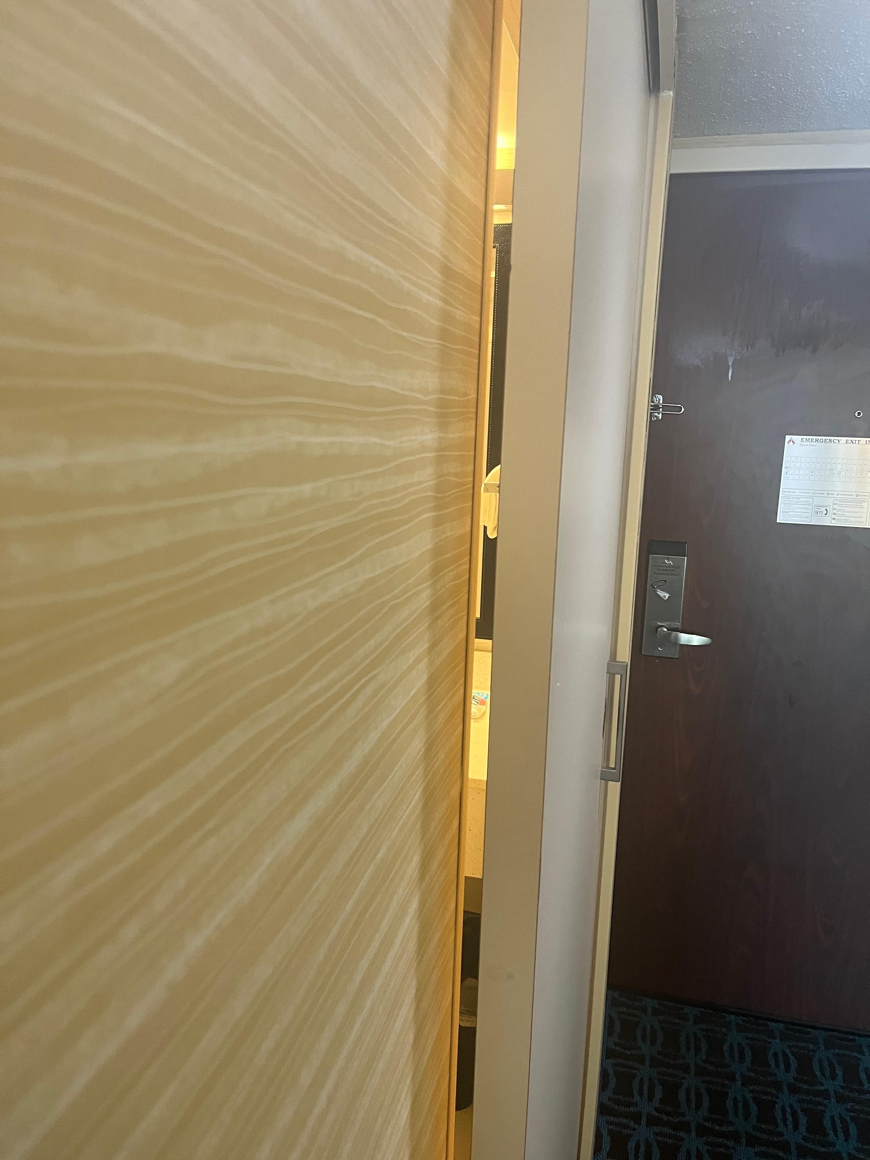 Looking through the door gap into the bathroom. 