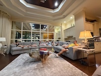 Family room with huge couch, and plenty of seating where a larger group is comfortable.