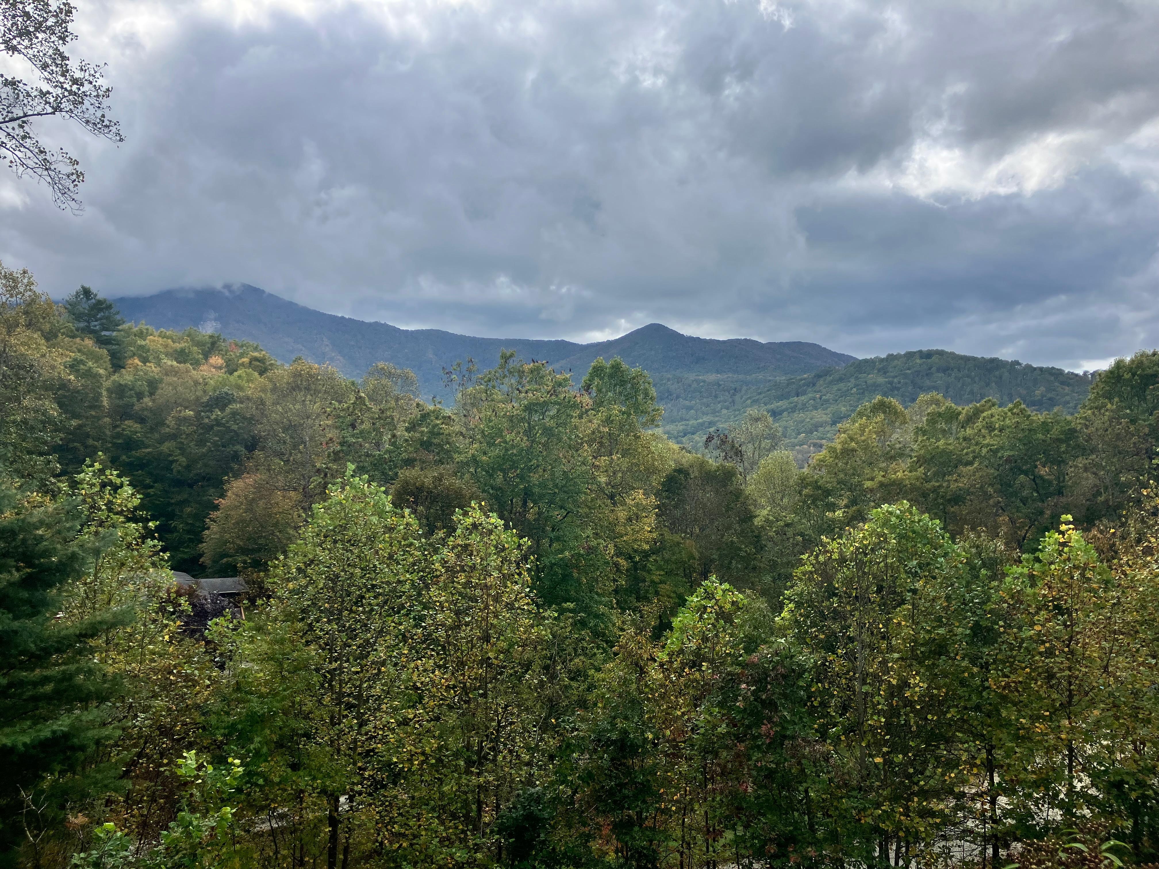 The clouds playing hide and seek with the mountain. 