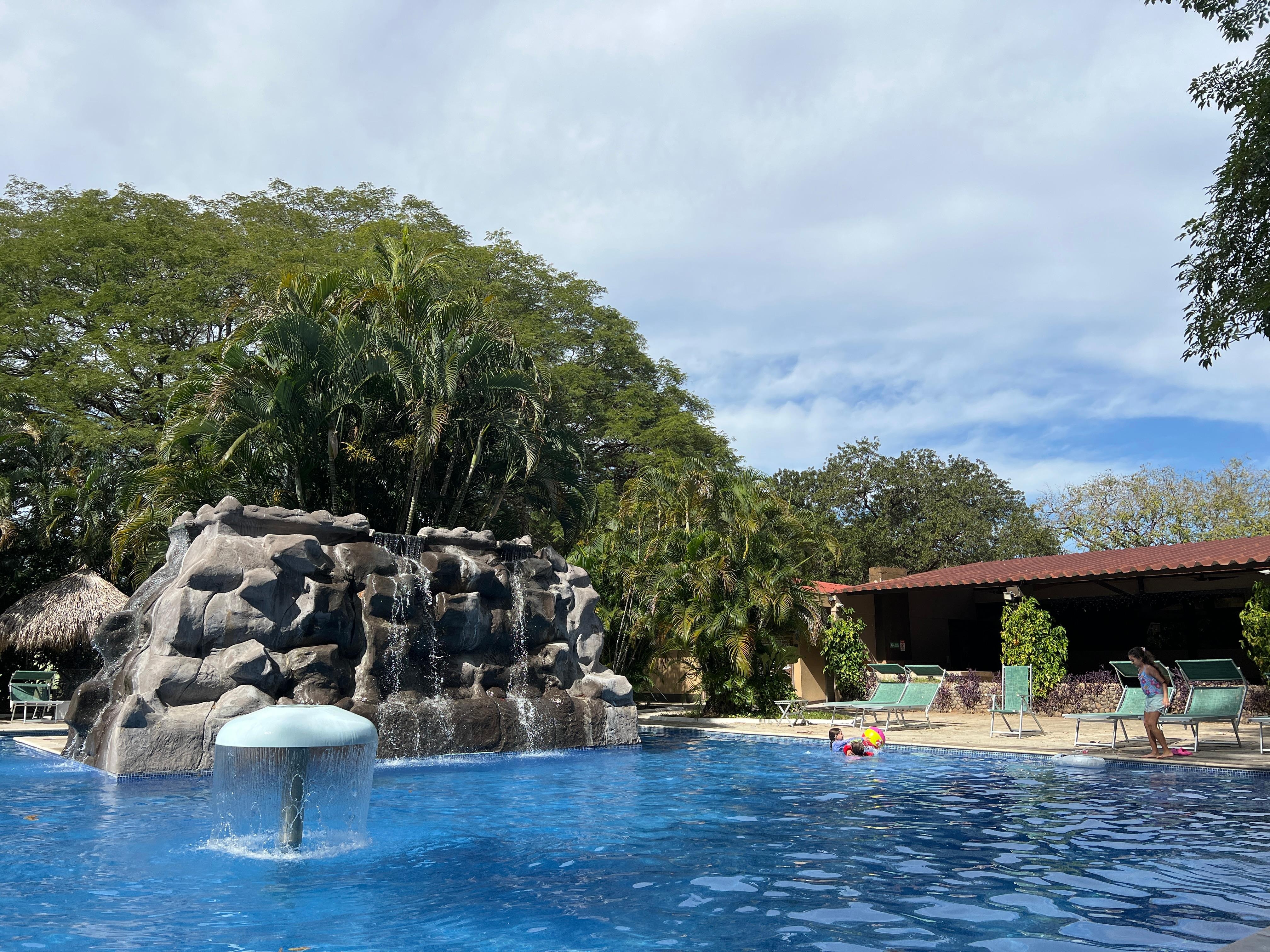 The children loved the pool and the peacocks .