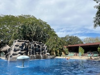 The children loved the pool and the peacocks .