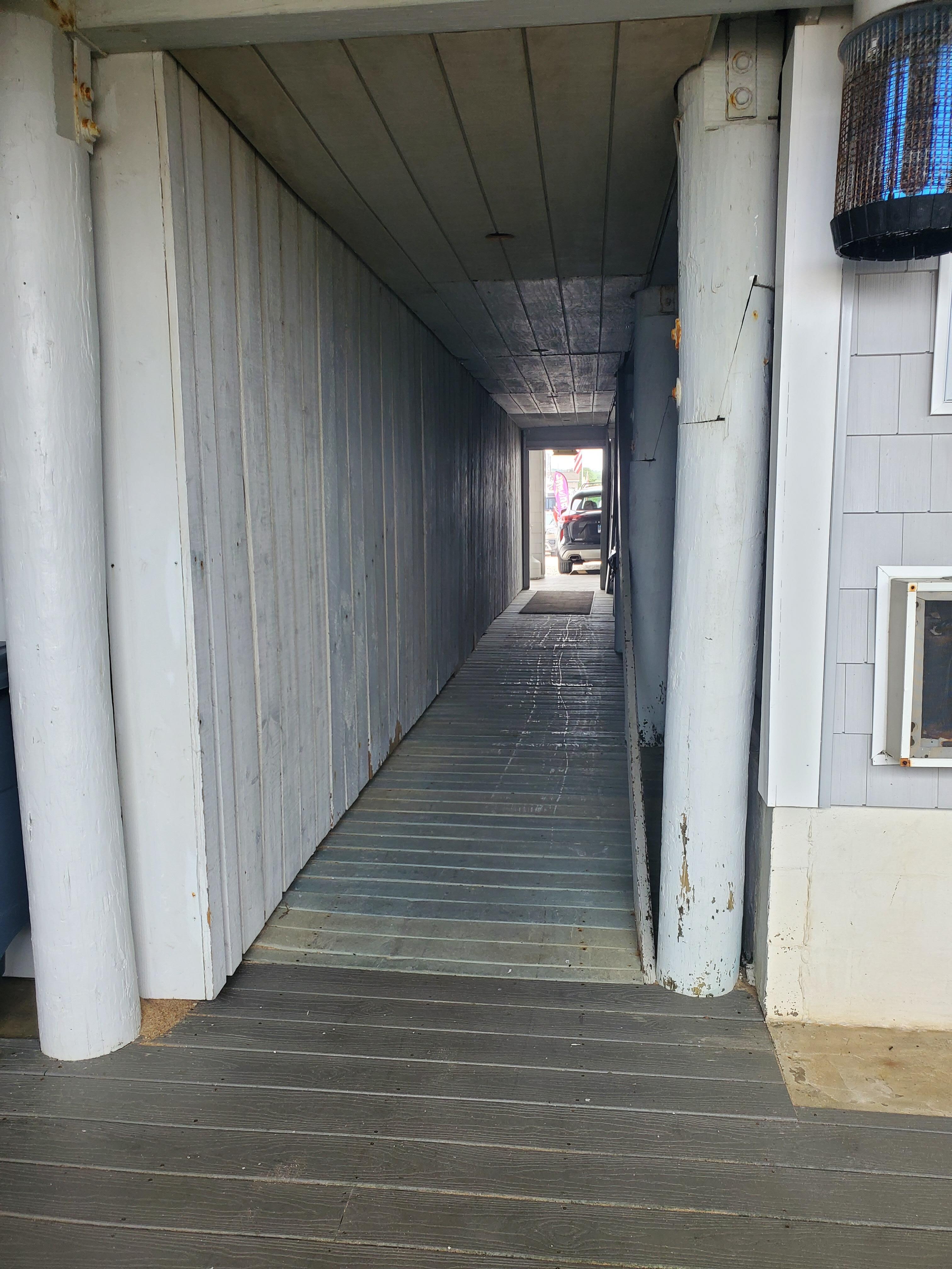 Walk way to street side,parking lot and front desk