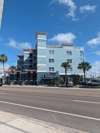 The outside of the condo, looking at it from the other side of the street.