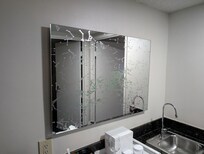 Odd mirror above bar sink- kinda makes you dizzy to use it!