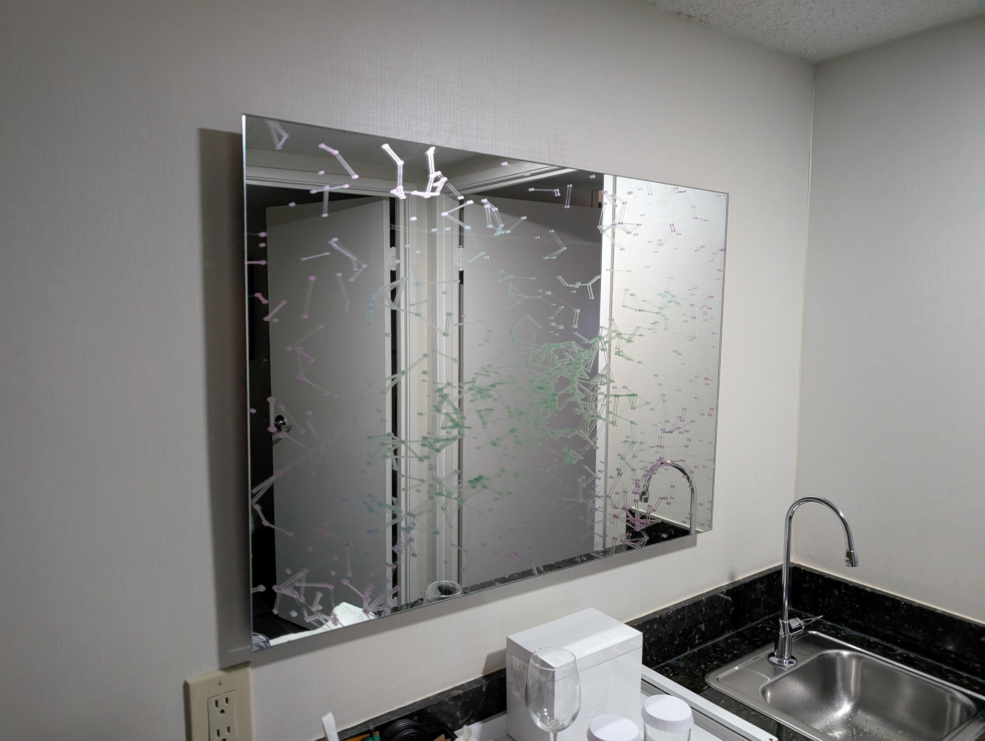 Odd mirror above bar sink- kinda makes you dizzy to use it!