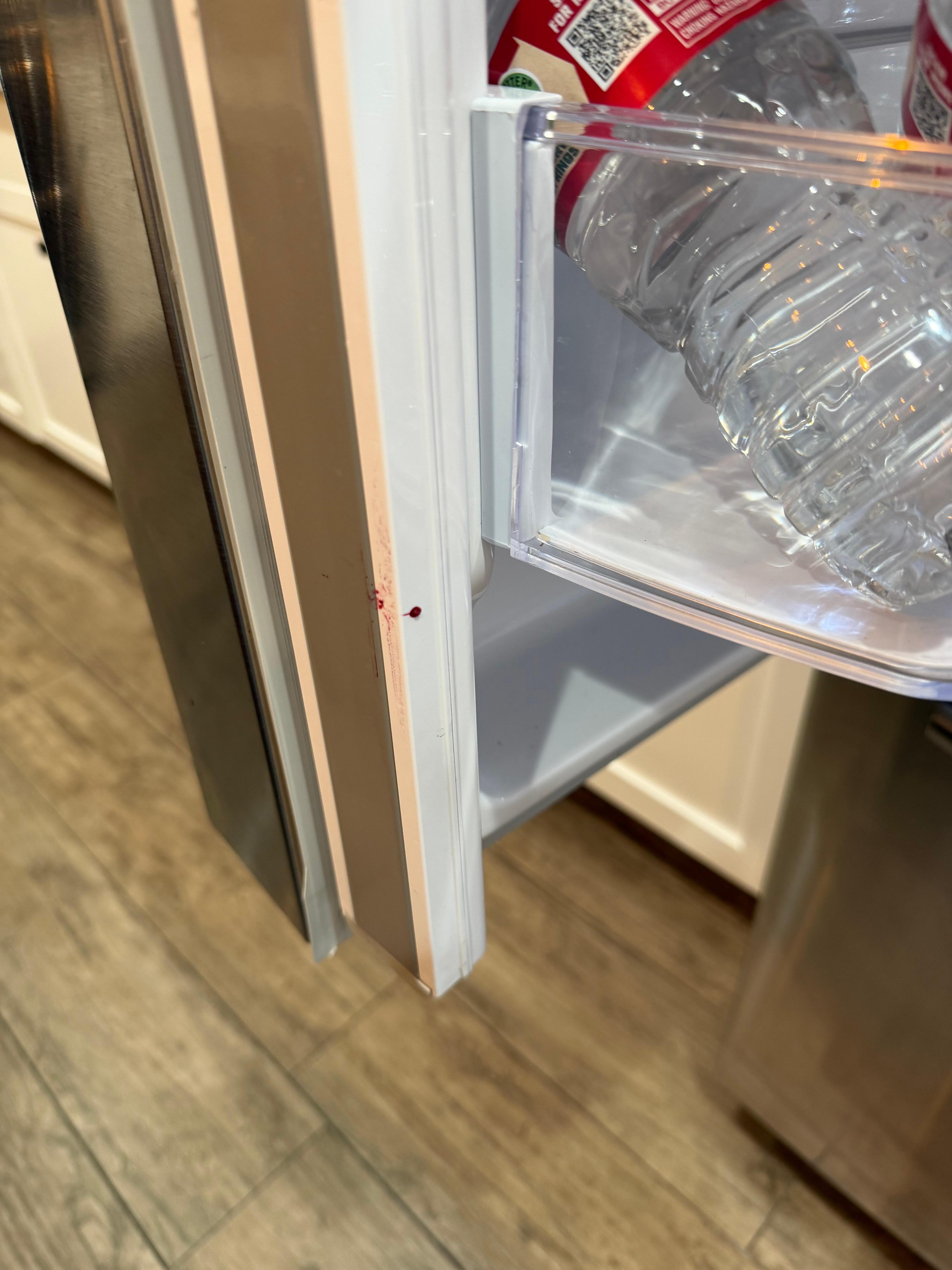 Red substance on refrigerator upon check in