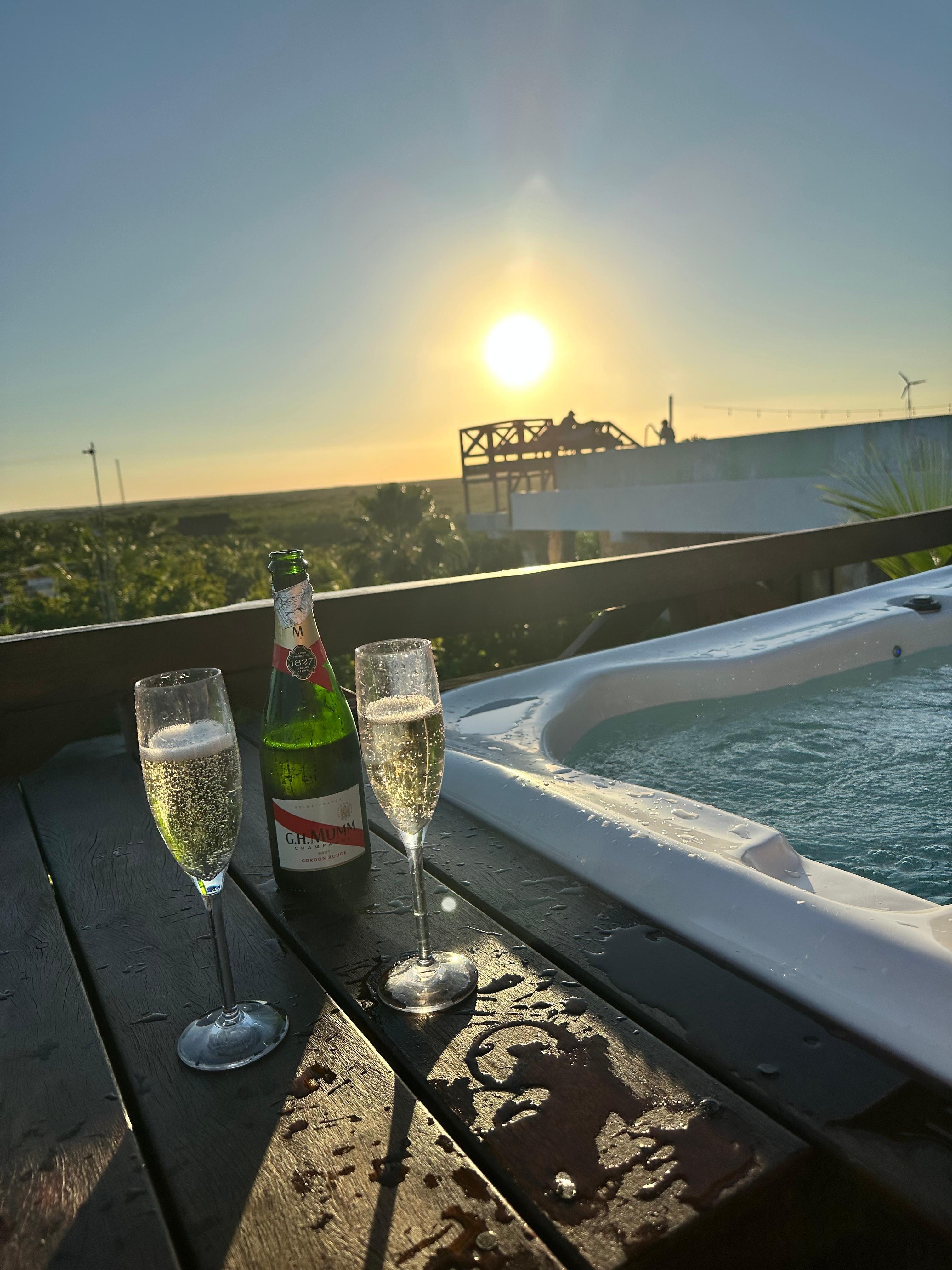 Sunset by rooftop hotub