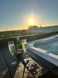 Sunset by rooftop hotub