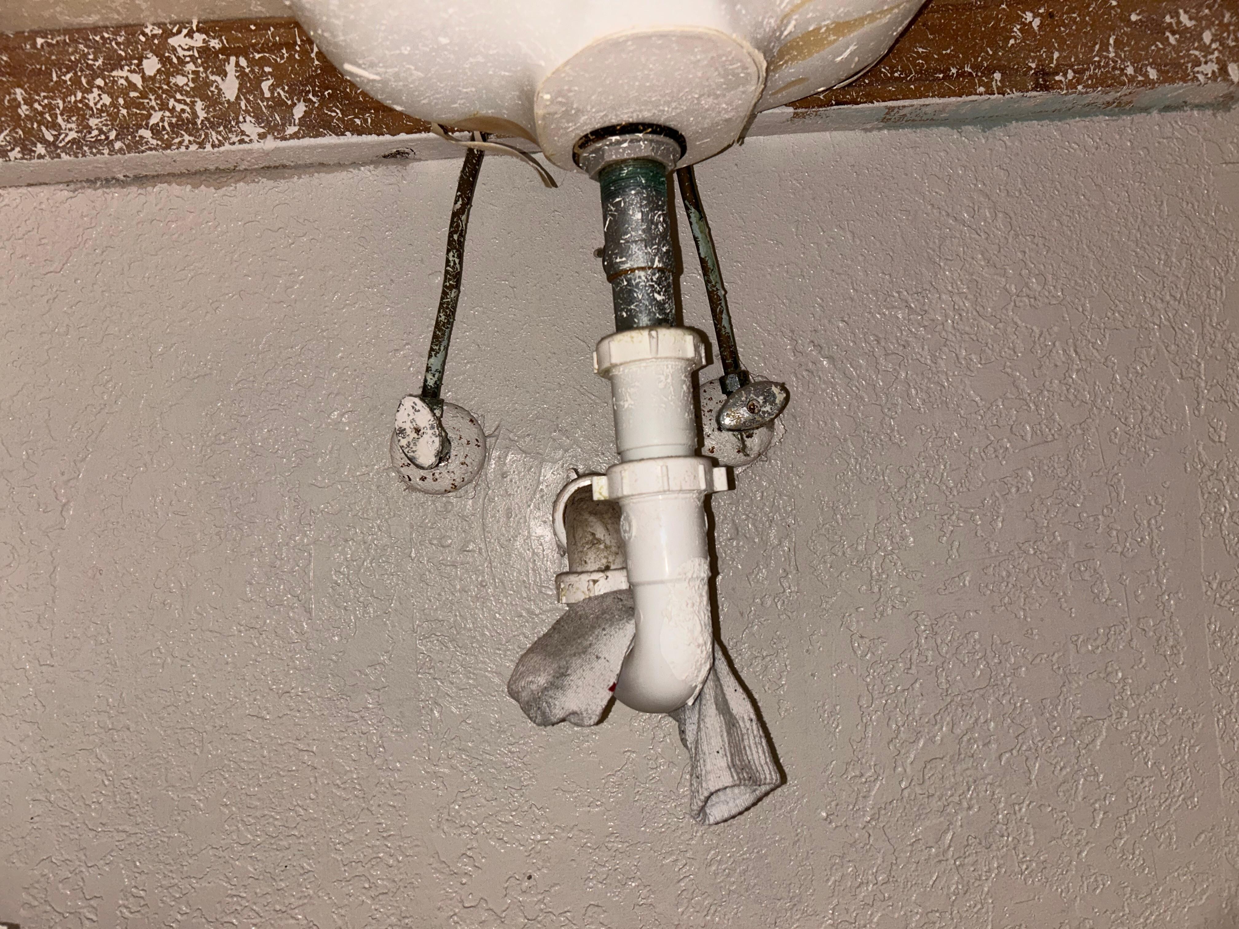 Located under the sink 