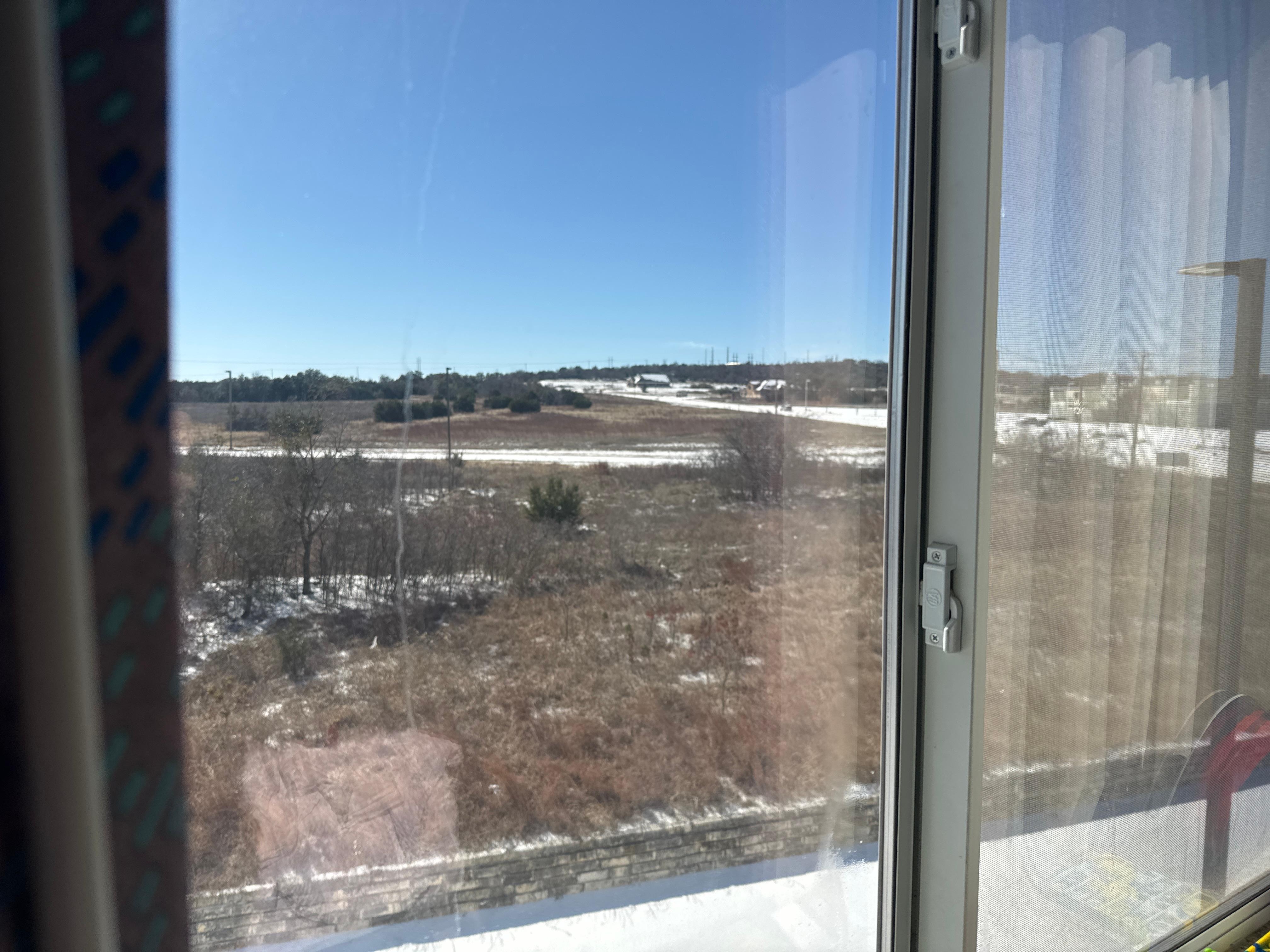 From 3rd floor , outside is cover by snow due to winter storm . 