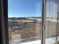 From 3rd floor , outside is cover by snow due to winter storm .