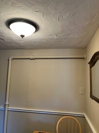 Exposed pipes. This room was not the worth the value paid.