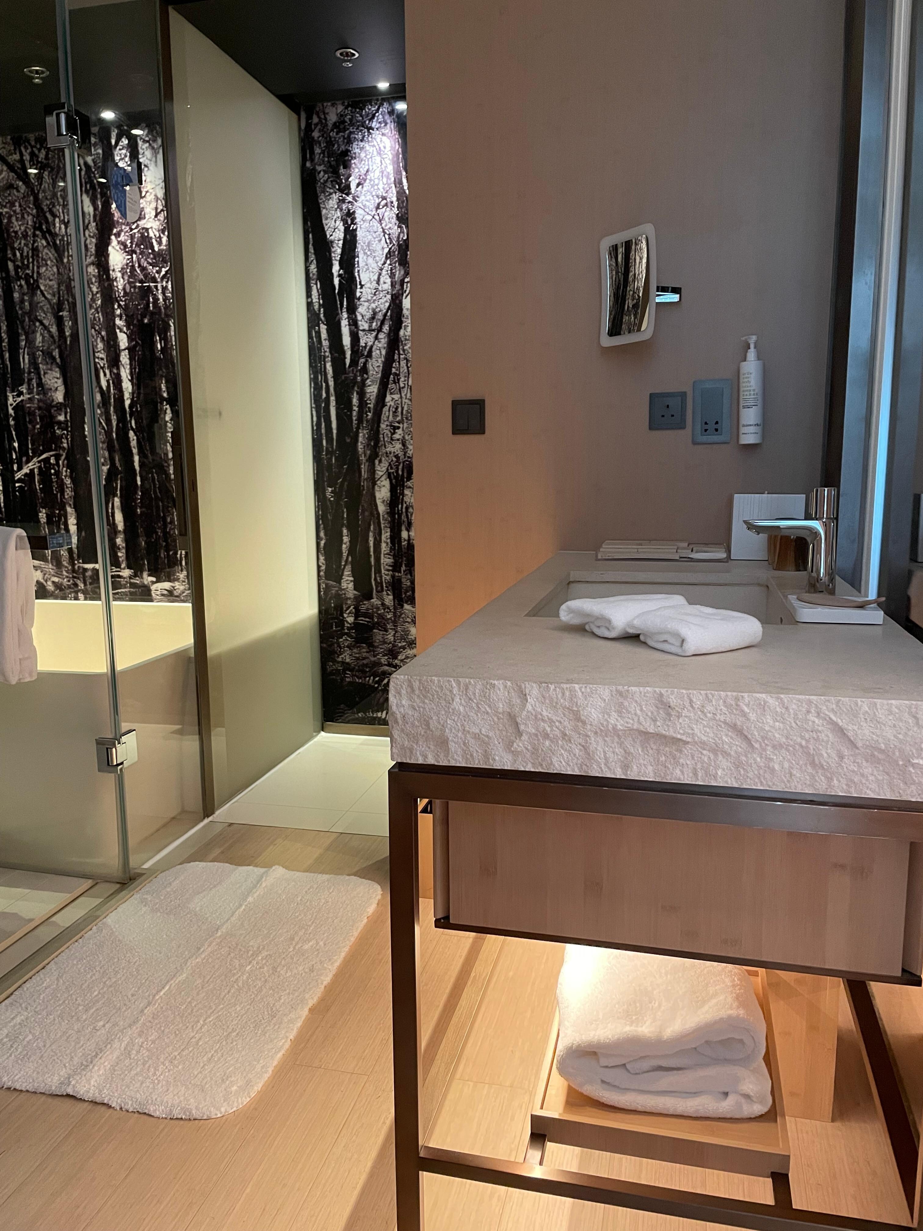 One big sliding door separates the sleeping area and the bath area.