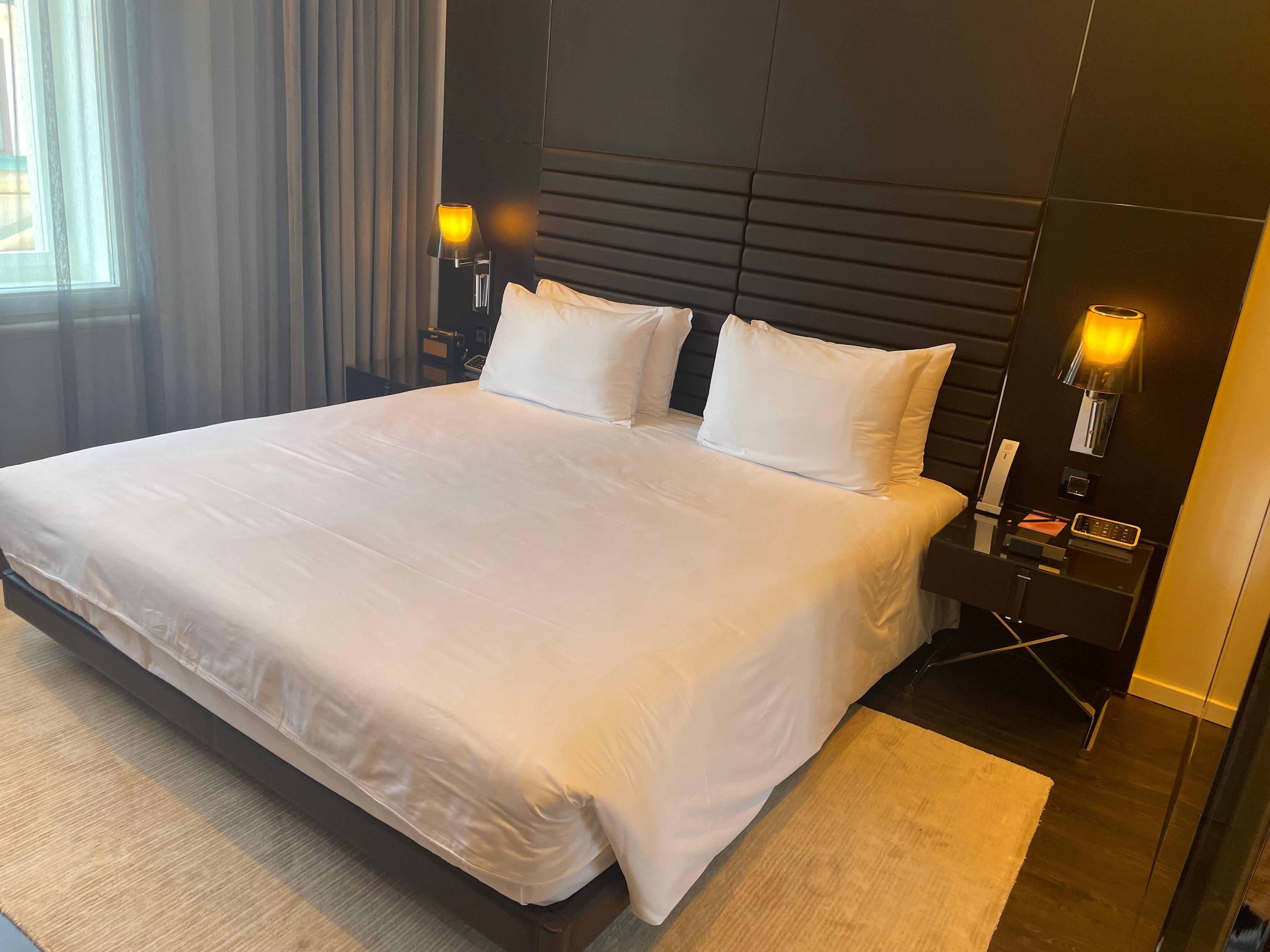 Bed has a remote control for everything in the room.