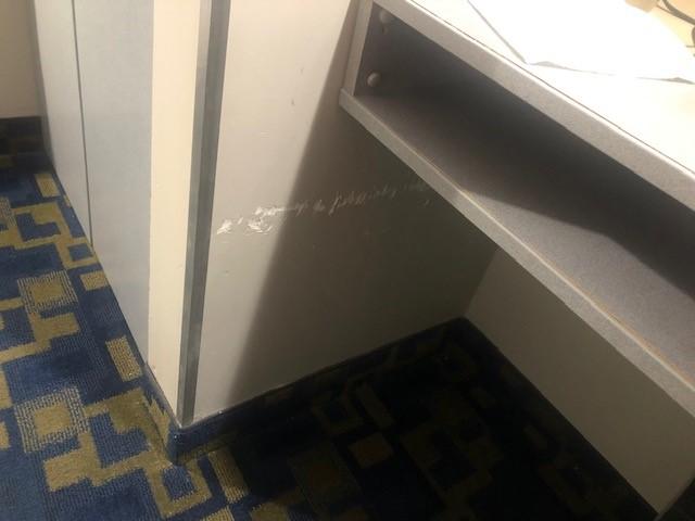 Wall scuffs next to desk area