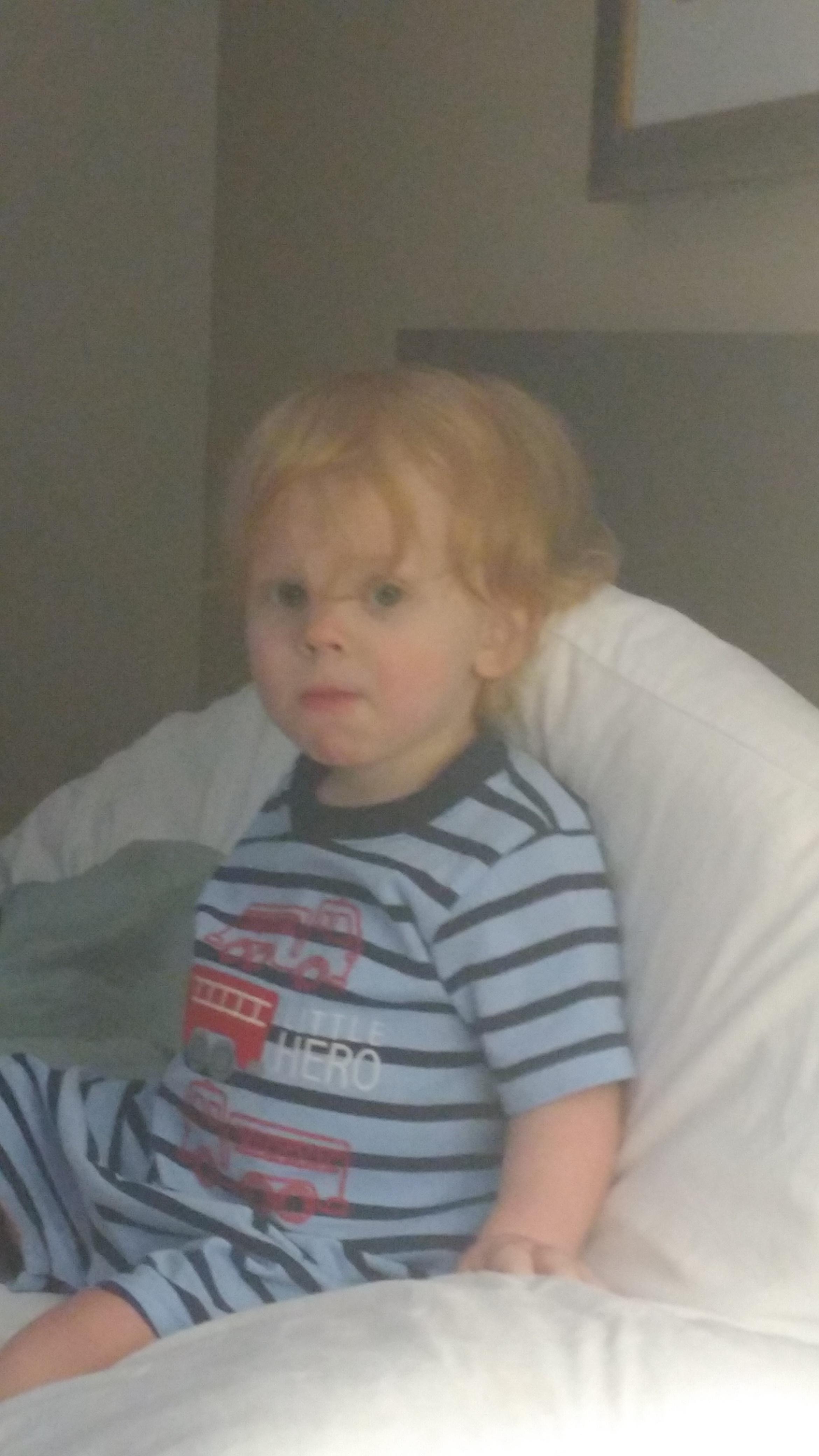 sick baby watching cable TV with AC on.
