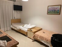 Twin Bed in different room with partial sea view on Balcony