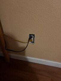 No cover on outlet. Hazard