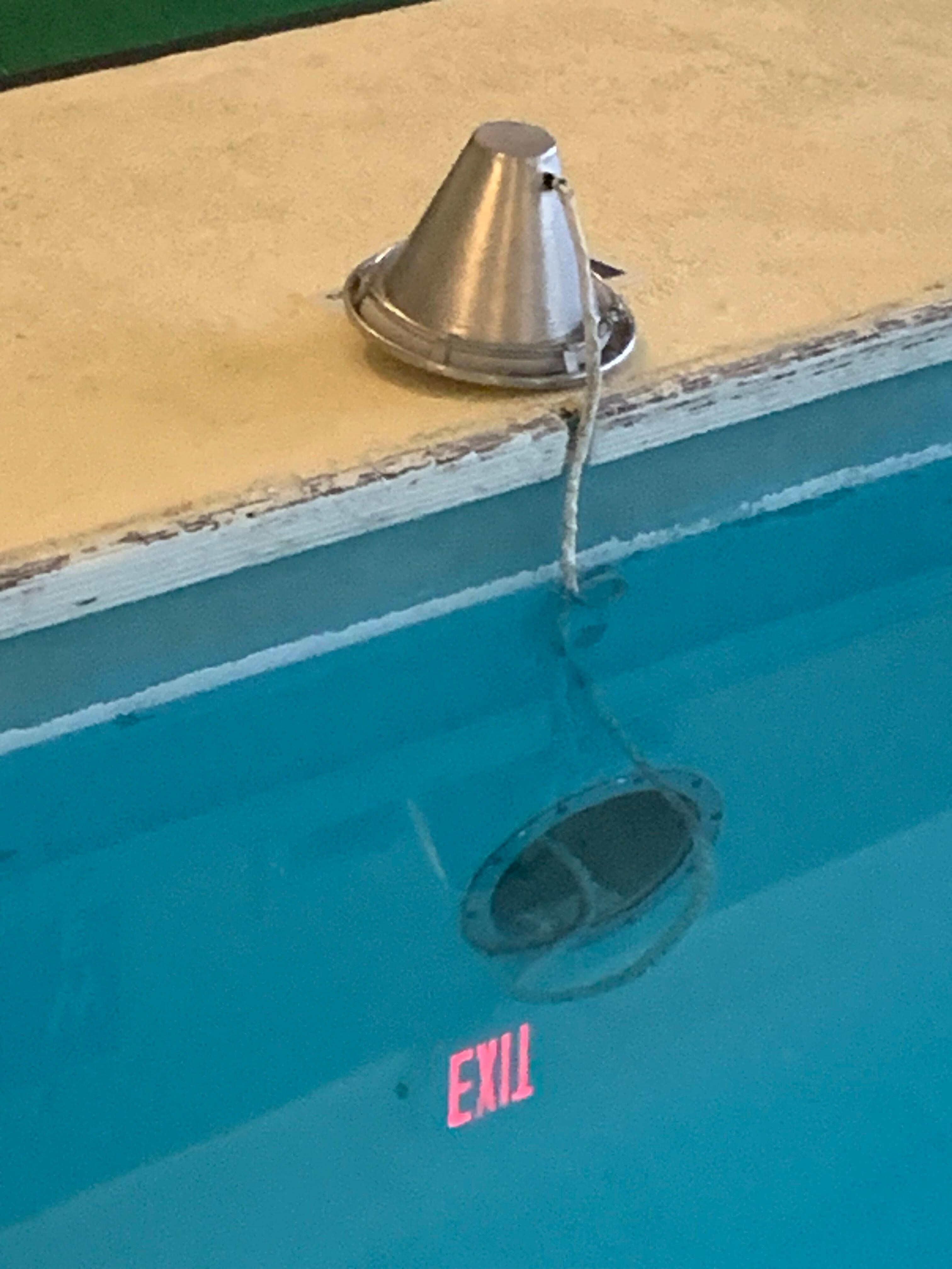 dangerous broken light and wires in water